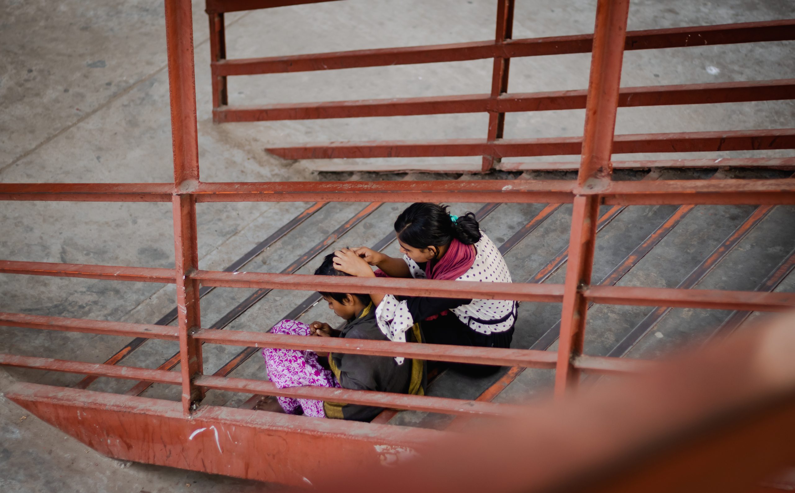 Two sisters sit and talk to each other