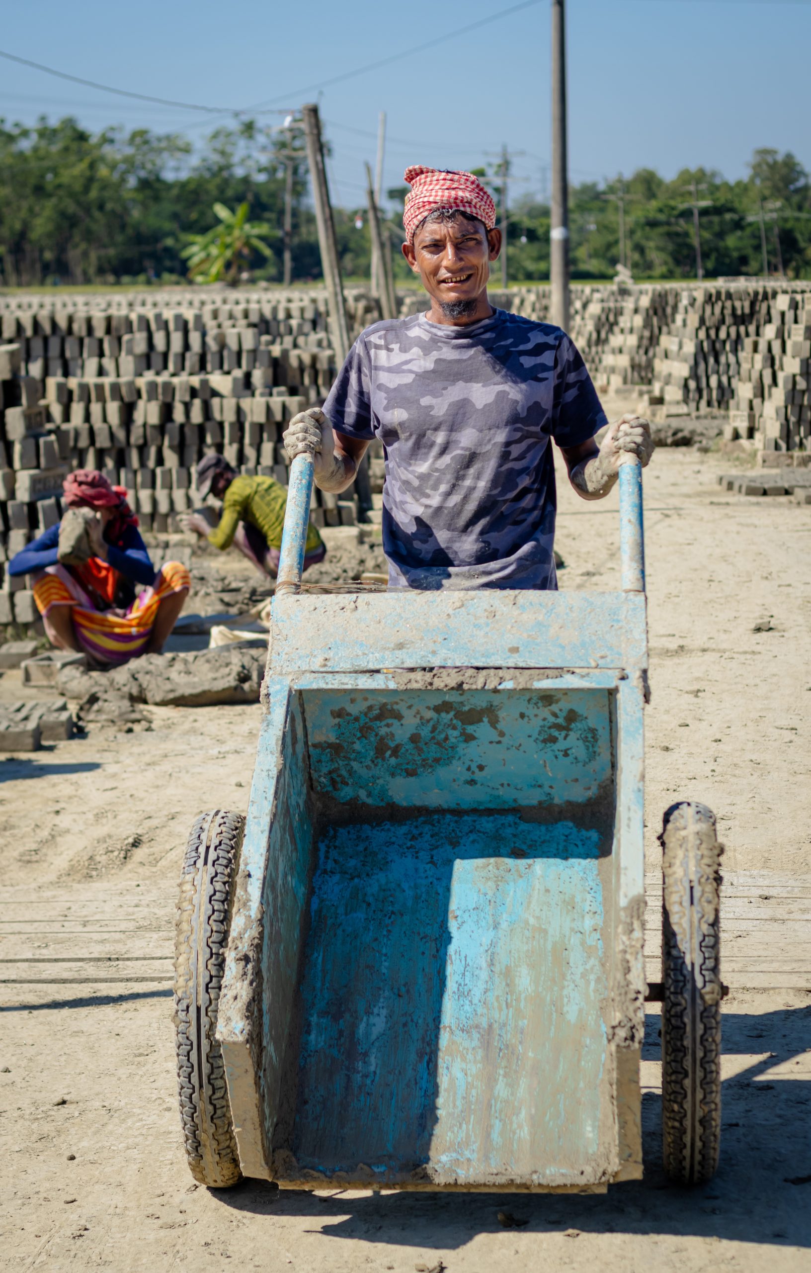 In dust and heat, a worker’s silent struggle unfolds.