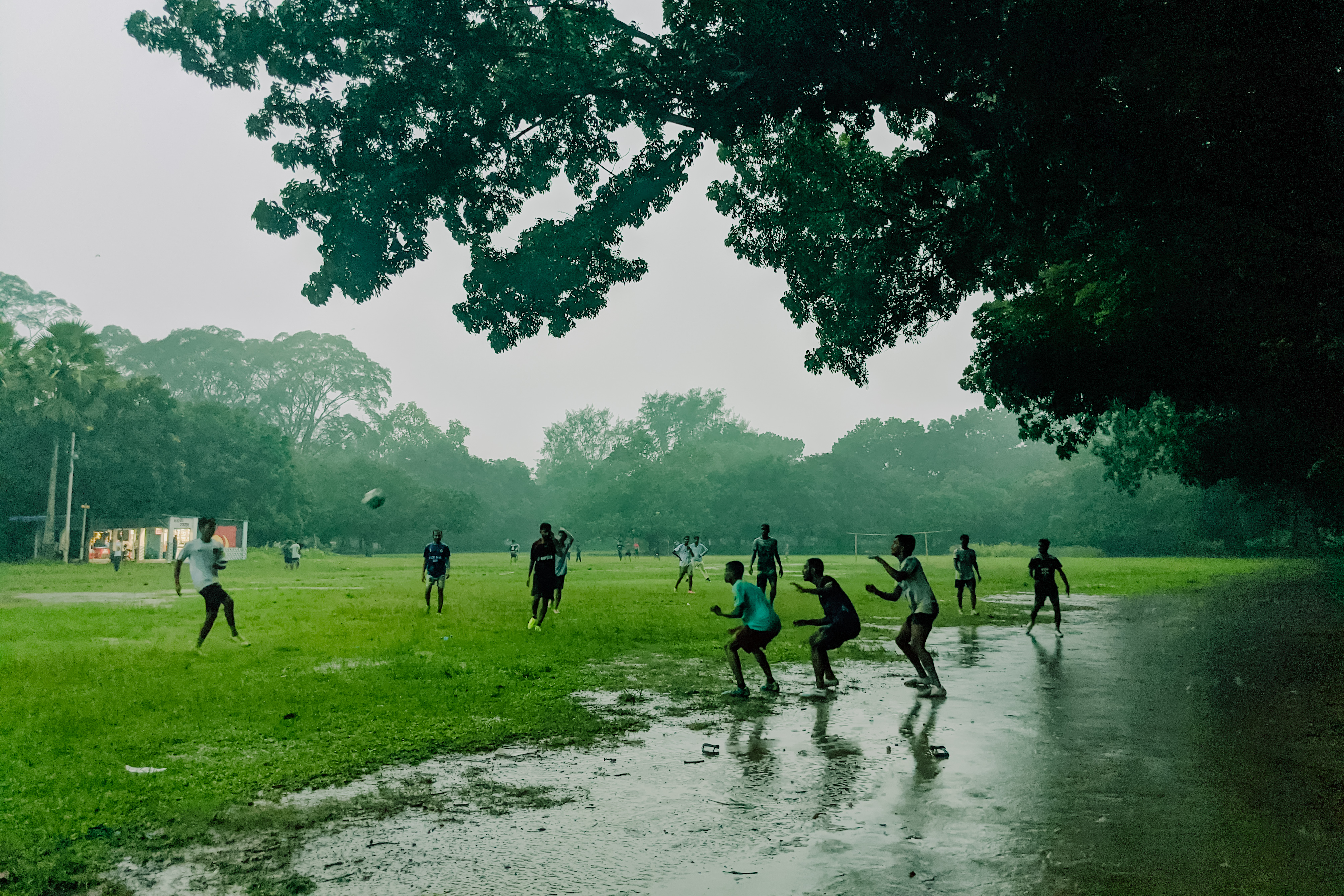 Playing football on a rainy day