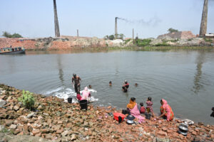 Bathing Beside Brick Kilns